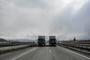 2 trucks on road